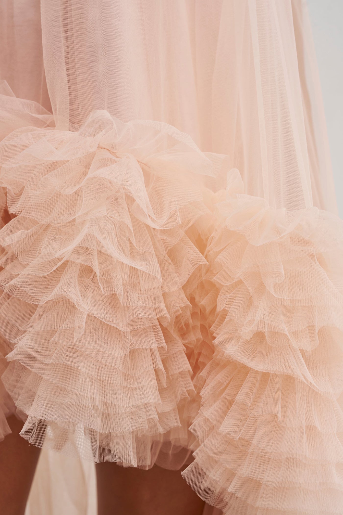 ARI TULLE RUFFLE HIGH LOW MINI DRESS IN BLUSH